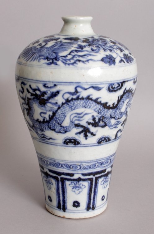 A CHINESE YUAN/MING STYLE BLUE & WHITE PORCELAIN: A CHINESE YUAN/MING STYLE BLUE & WHITE PORCELAIN MEIPING VASE, decorated with dragon and phoenix, the base unglazed, 8.5in high.