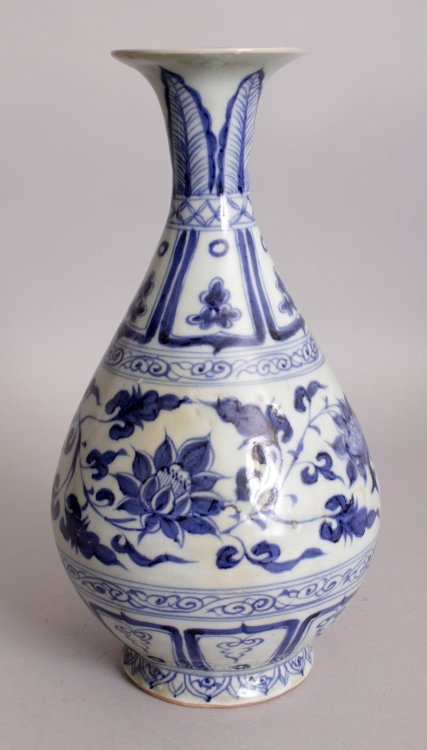 A CHINESE YUAN STYLE BLUE & WHITE YUHUCHUNPING: A CHINESE YUAN STYLE BLUE & WHITE YUHUCHUNPING PORCELAIN VASE, decorated with a band of formal scrolling foliage, the base partially unglazed, 10.7in high.