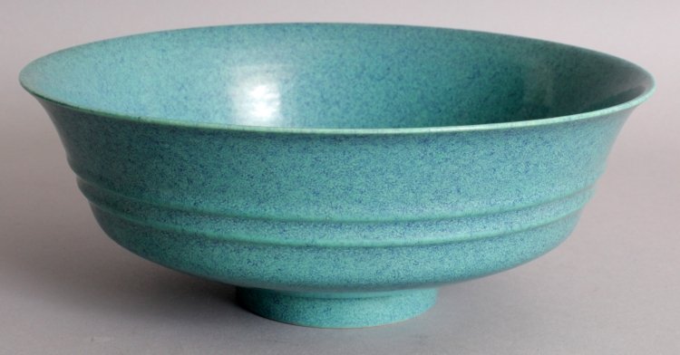 A CHINESE ROBIN’S EGG GLAZED PORCELAIN BOWL, the: A CHINESE ROBIN’S EGG GLAZED PORCELAIN BOWL, the flaring sides moulded with two ribs, the base with a six-character mark in underglaze-blue, 8.3in diameter & 3.2in high.