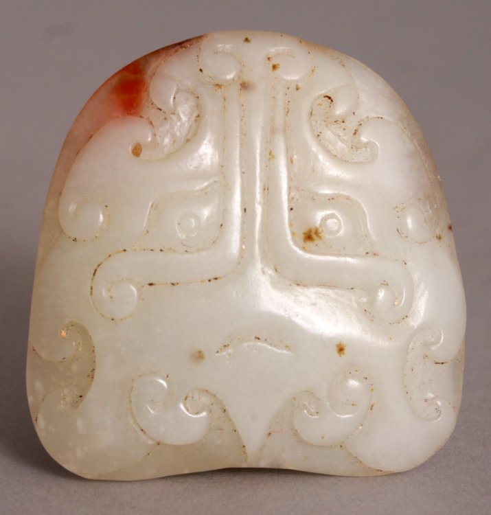 A CHINESE WHITE JADE CARVING, each side with an archaic (1 of 5)