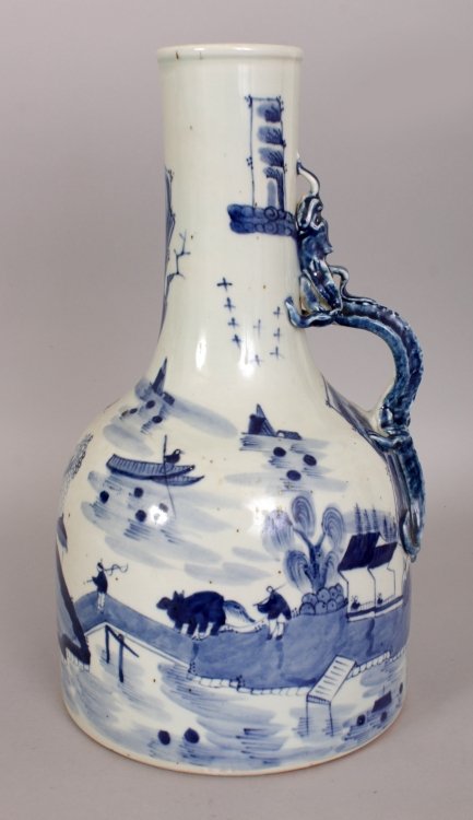 AN UNUSUAL CHINESE BLUE & WHITE PORCELAIN WATER JUG,: AN UNUSUAL CHINESE BLUE & WHITE PORCELAIN WATER JUG, with a dragon handle, decorated with a river landscape setting, 12.5in high.