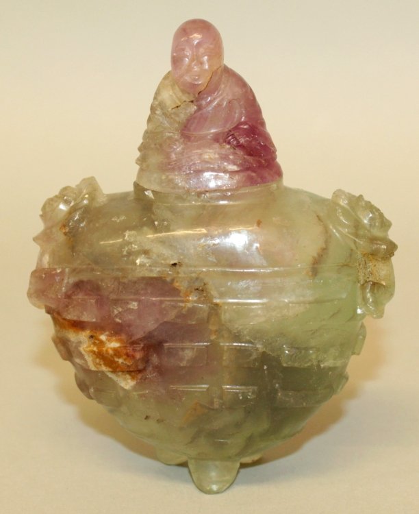 AN EARLY 20TH CENTURY CHINESE GREEN BOWENITE ARCHAIC: AN EARLY 20TH CENTURY CHINESE GREEN BOWENITE ARCHAIC TRIPOD VASE & COVER, together with a fitted wood stand, the sides of the vase carved with trigrams, 4.3in high overall, the vase itself 3.3in wide 