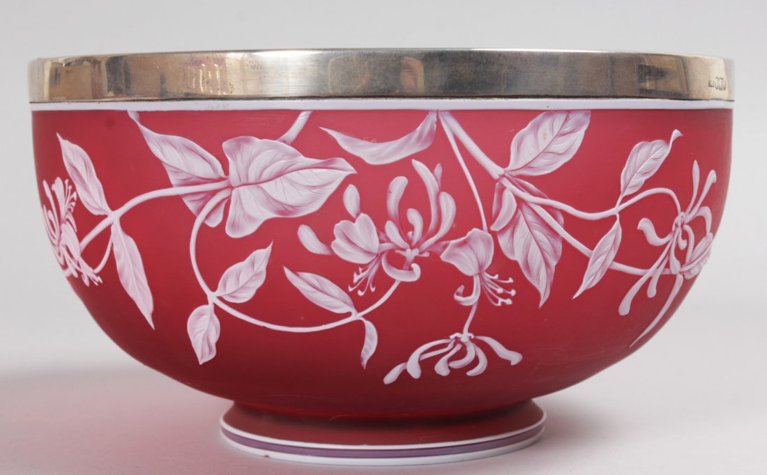 A SUPERB THOMAS WEBB & SON "CAMEO" RUBY GLASS CIRCULAR: A SUPERB THOMAS WEBB & SON "CAMEO" RUBY GLASS CIRCULAR BOWL with silver rim. London 1901. 9ins diameter. Mark on base.