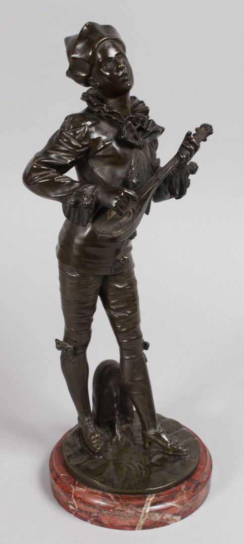 ADOLPHE JEAN LAVERGNE (19TH CENTURY) FRENCH A GOOD: ADOLPHE JEAN LAVERGNE (19TH CENTURY) FRENCH A GOOD BRONZE OF A STANDING BOY PLAYING A MANDOLIN. Signed on a circular marble base. 15ins high.