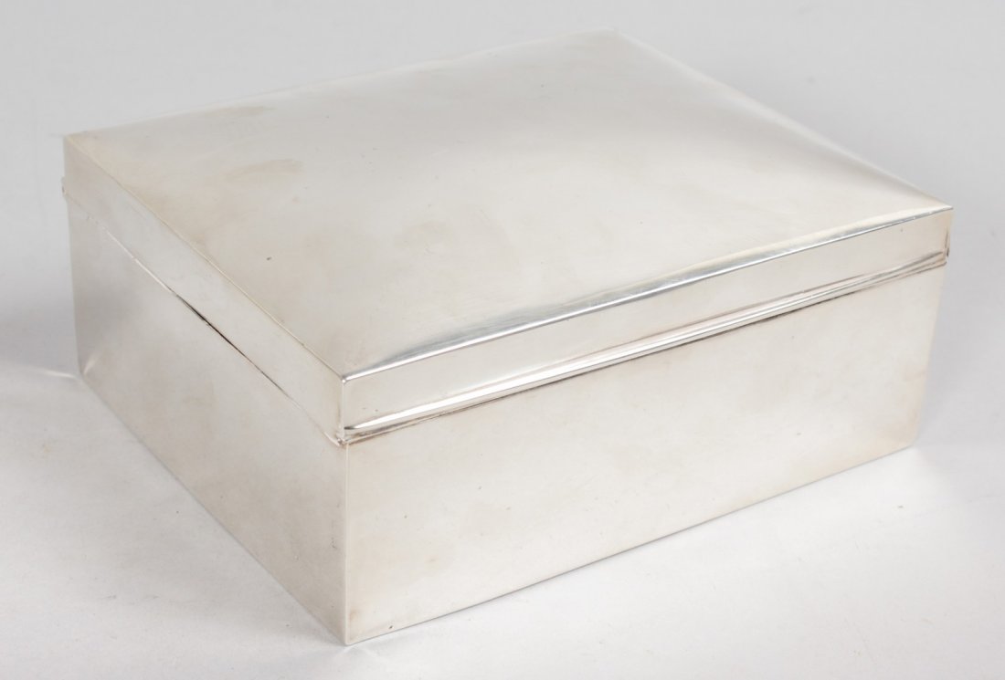 A LARGE PLAIN CIGARETTE BOX with cedar wood lining.: A LARGE PLAIN CIGARETTE BOX with cedar wood lining. 6.5ins long. Birmingham 1912.