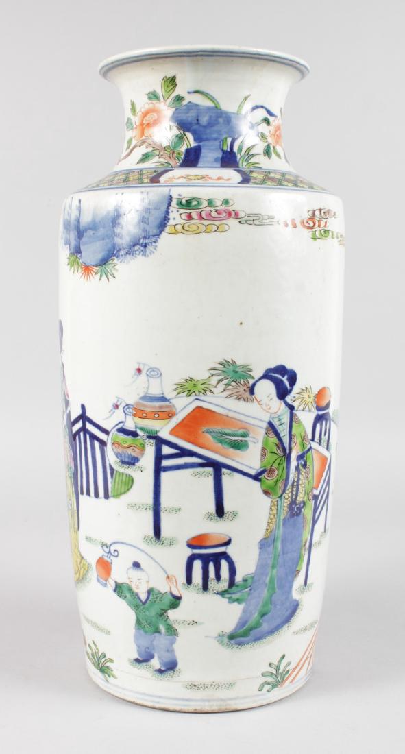 A CHINESE PORCELAIN VASE, painted with figures and palm: A CHINESE PORCELAIN VASE, painted with figures and palm trees. 16ins high.