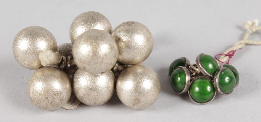 NINE .800 SILVER BALLS on a piece of string and a bag: NINE .800 SILVER BALLS on a piece of string and a bag of buttons.