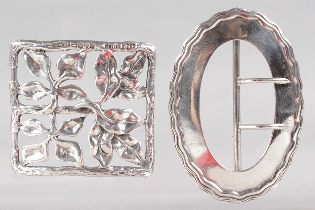 A SQUARE ART NOUVEAU SILVER BUCKLE, Chester 1905 and AN: A SQUARE ART NOUVEAU SILVER BUCKLE, Chester 1905 and AN OVAL BUCKLE, Birmingham 1908.