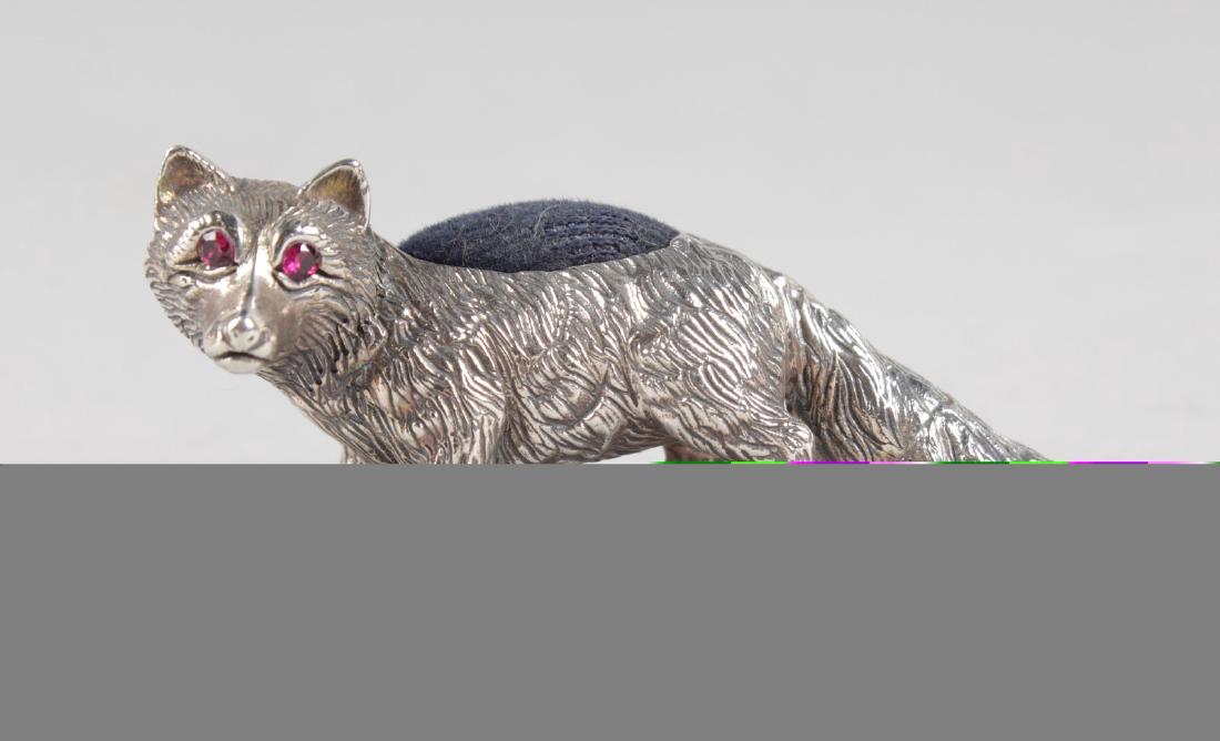 A SILVER NOVELTY FOX PIN CUSHION. 5ins long.: A SILVER NOVELTY FOX PIN CUSHION. 5ins long.