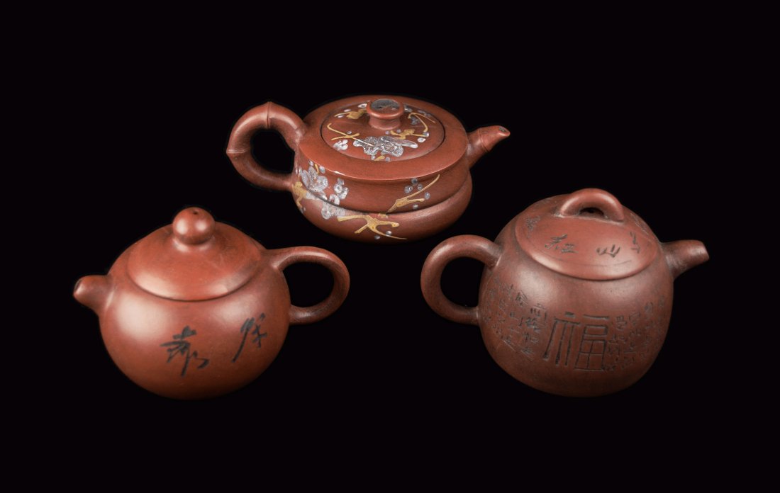 A Set of Three Chinese Yixing Clay Tea Pots, marked: A Set of Three Chinese Yixing Clay Tea Pots, marked as "Made by Qian Xizhen", "Wang Jialiang", and "Chen Li Pottery" | 紫砂壺三件 分別為『錢