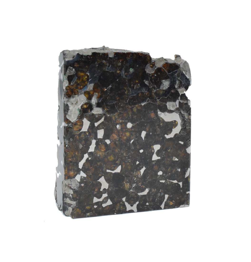 Seymchan Pallasite Meteorite Slice 222 grams: Seymchan pallasite meteorite from Russia. 50% olivine / 50% metal. 222 grams. Measures 62mm x 79mm x 18mm. Seymchan was found in 1967. This meteorite collection was reviewed and authenticated by Dr. P