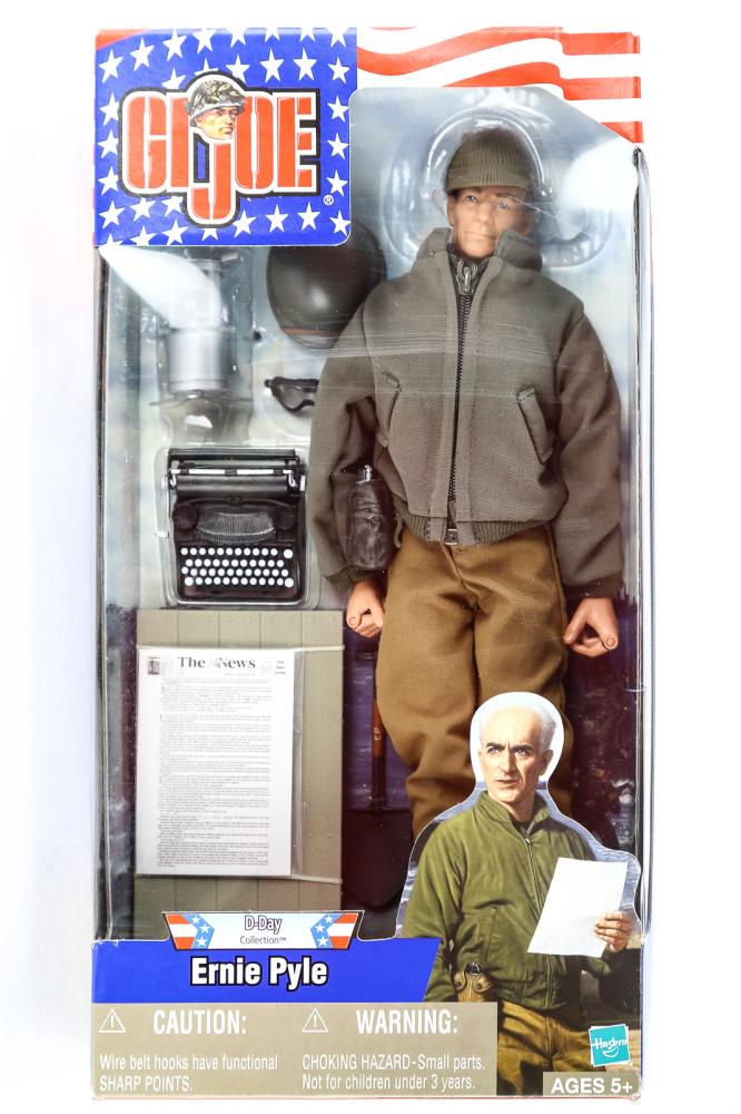 GI Joe D-Day Collection Ernie Pyle Figure 2001: GI Joe D-Day Collection Ernie Pyle action figure from 2001. New in the box. Box shows some shelf wear.