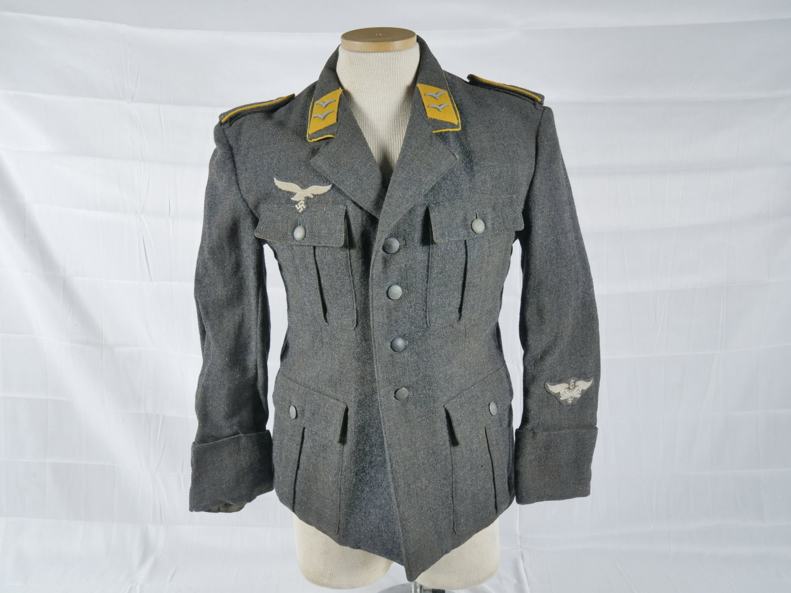 WWII German Luftwaffe Fleiger Tunic: Late war. For enlisted soldiers. Made from last ditch wool material. Excellent condition. Disclaimer: Due to the high quality of Nazi fakes, Donley Auctions has described this item to the best of thei