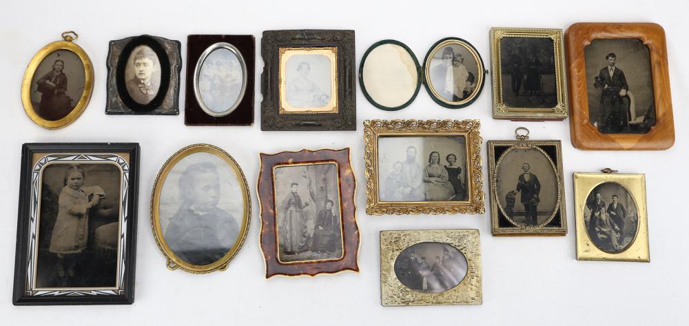 Group of Picture Frames: Frames with vintage images, including a tortoise shell frame with an image of two women, one on a swing, a tintype of a seated woman, a contemporary framed image of a tintype of a man and a woman and
