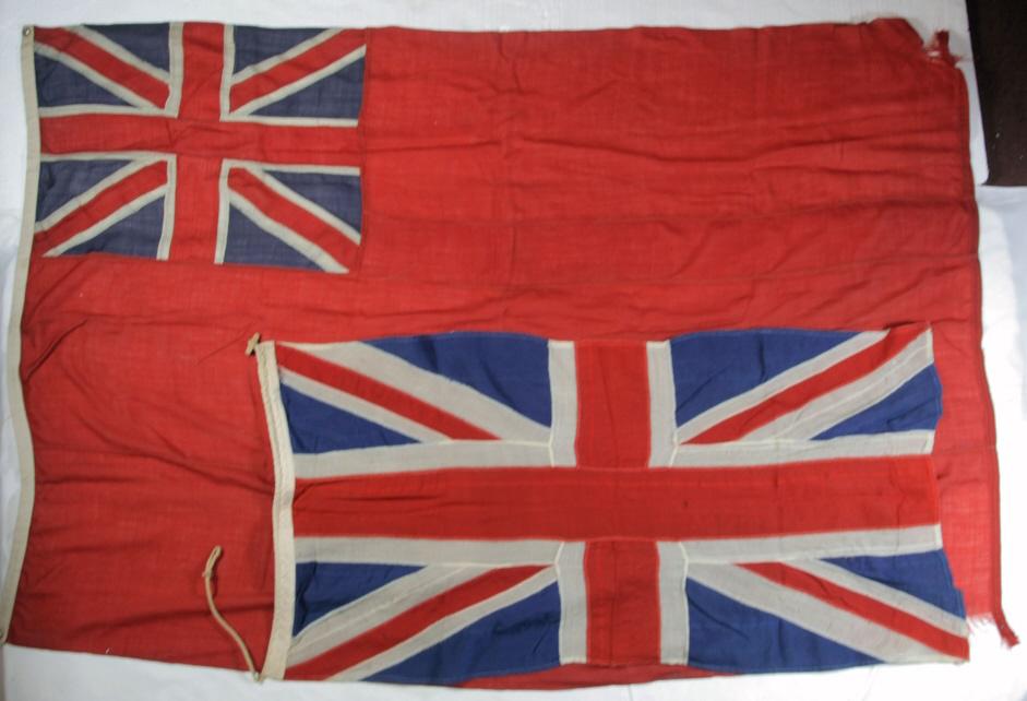 British Flags (2): Red Ensign ("Red Duster") British flag, multiple pieces, frayed in bottom corner, cotton, 90"x60", British flag, multiple pieces, rope in end, cotton, 30"x61"