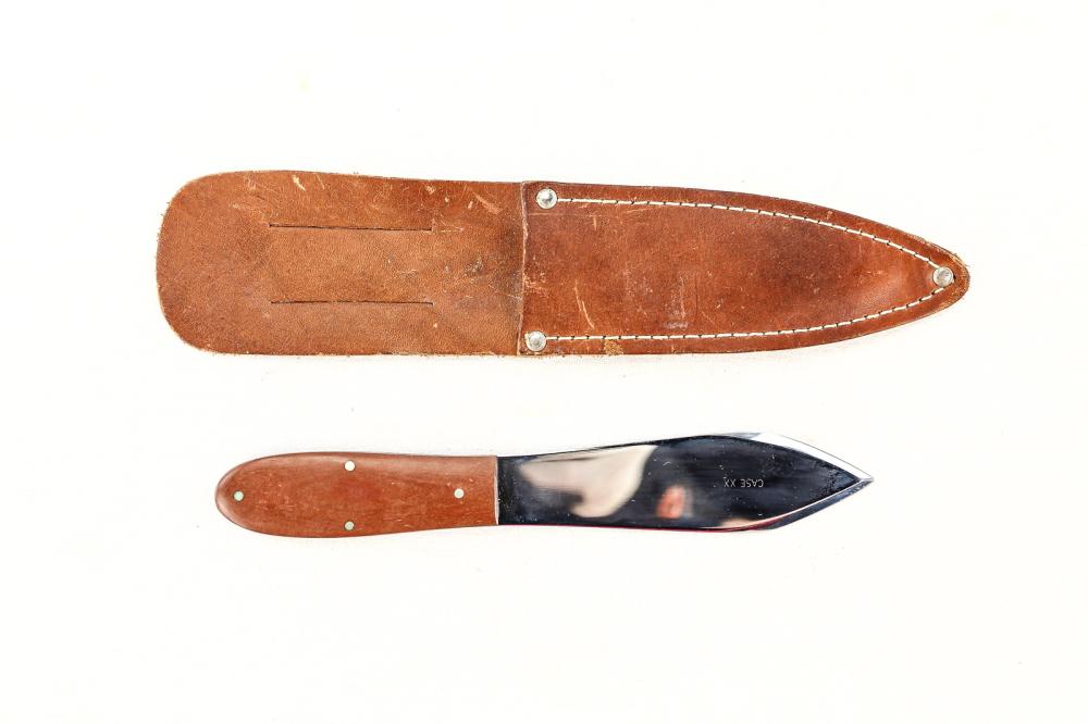 Case XX Throwing Knife: Stamped Case XX on blade. Factory sharpened blade and point. Flat profile plastic handle. Leather sheath in good condition. Blade measures 4.25", overall measures 9". See photos.