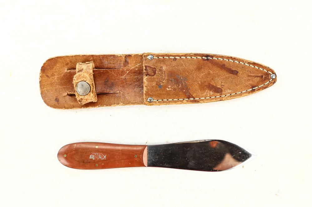 Throwing Knife: Stamped Kinfolks USA. Plastic flat profile grip. Unsharpened double edged blade. Leather scabbard also stamped Kinfolks. Blade measures 4-1/8", overall with sheath measures 8-7/8". See photos.