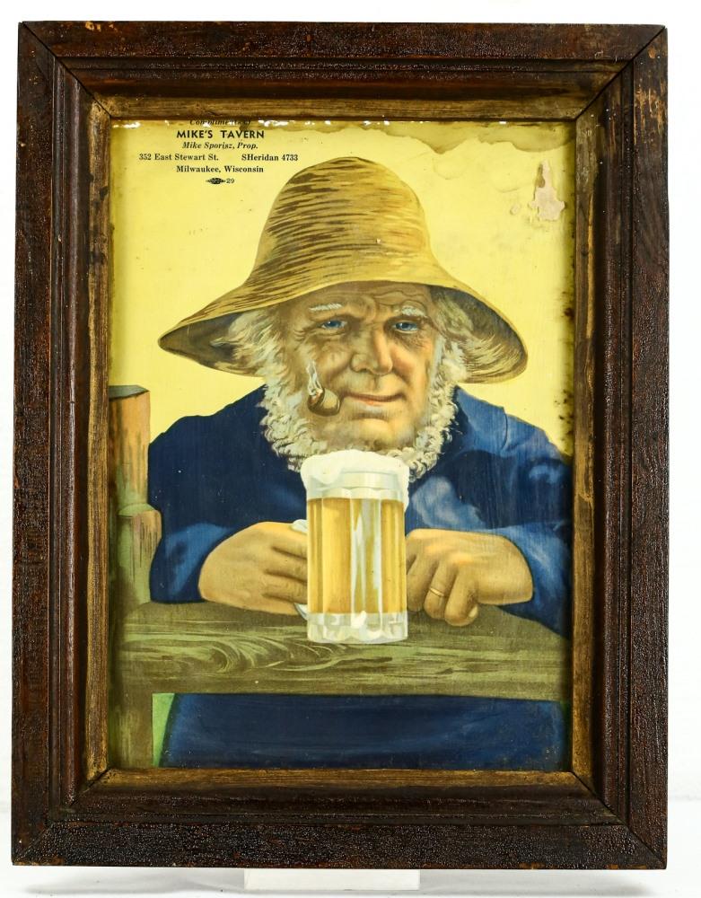 Mike's Tavern Framed Advertisement Poster: A framed advertisement poster for Mike's Tavern of Milwaukee, WI. Poster shows an older man smoking a pipe and a mug of beer in hand with the address for Mike's Tavern in the top left corner. Poster i