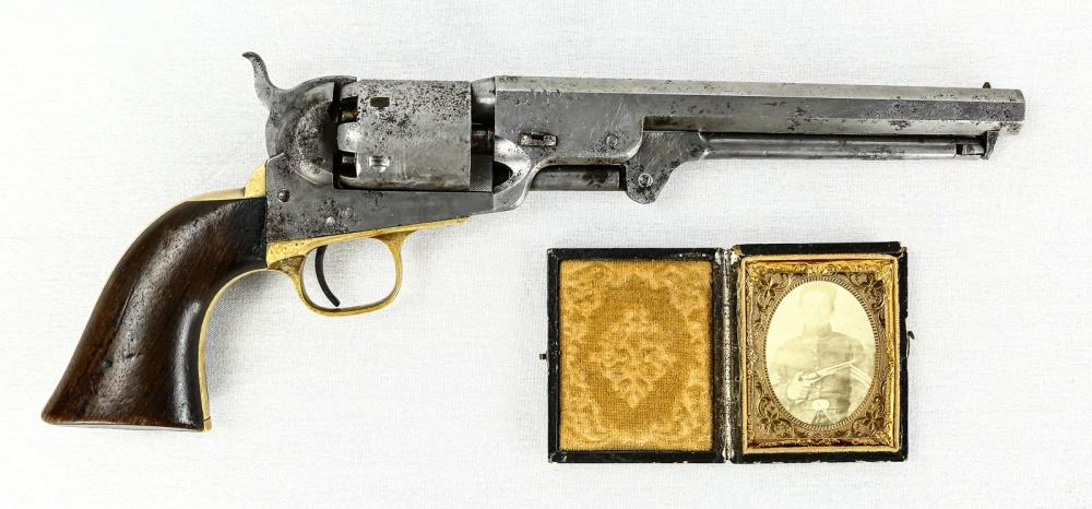 Colt 1851 Navy Revolver W/ Tintype(Photo): Colt Model 1851 Navy black powder manufactured in 1861. Caliber .36. Pistol is heavily worn with age and the finish has been stripped off. All parts are matching and pistol is in working condition. Co