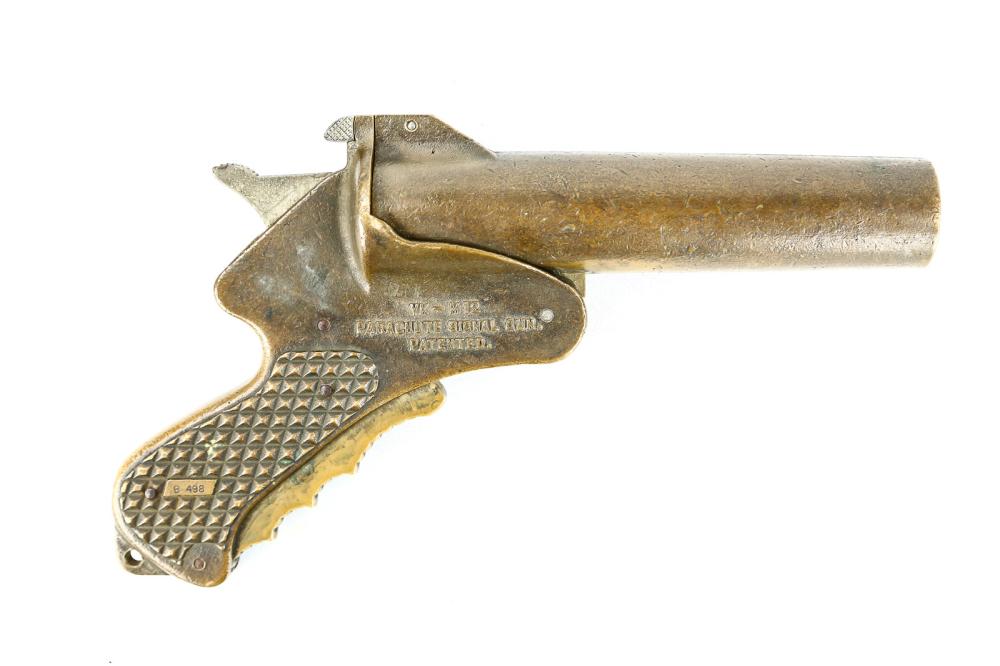 Van Karner M12 Flare Pistol: 1945 dated. Solid brass construction. Very interesting "Buck Rogers" style design. Fired by whole hand. Very uncommon. See photos.