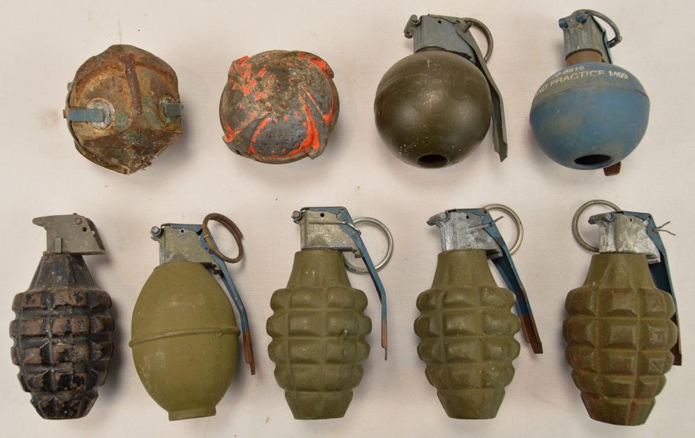 Lot of US Dummy Grenades: Lot contains 9 US dummy grenades of various types and vintages. 2 of the grenades are "baseball" style grenades. One grenade is missing the spoon and pin. Grenades range from poor to good condition. S
