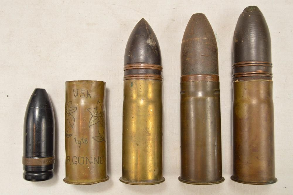 Lot of WWI Era Ordnance & Trench Art: Lot contains 3 37mm shells and a 37mm trench art shell decorated with flowers and marked "USA/1918/Argonne/Verdun". Lot also contains a projectile for a smaller shell, most likely 20mm. Two of the 37m