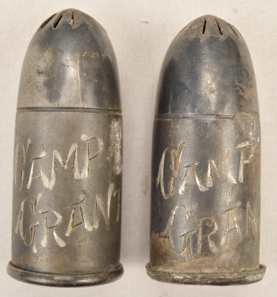 Lot of 2 WWI Trench Art "Camp Grant" Salt Shakers: A pair of salt & pepper shakers in the shape of artillery shells from WWI era America, both marked "Camp Grant" on the sides with the bottom marked "Rockford Silver P. Co., Quadruple". Trench art has 