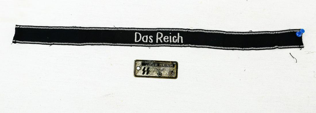 WWII German SS Das Reich Insignia: Lot contains a cuff title and a plate attachment both bearing the name of the 2nd SS Panzer Division "Das Reich". Plate has wear and oxidation on the front. Cuff title has some loose threading on edge