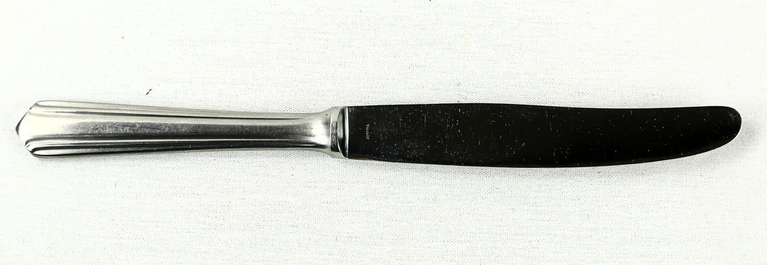 WWII German Adolf Hitler Butter Knife: A butter knife marked on the handle end "AH" in block letters and marked "Wellner, Inoxydable" on one side of the blade with the Wellner logo centered in the marking. Butter knife is in good condition