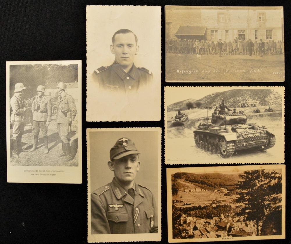 Lot of 6 WWII German Postcards: Lot has 6 German postcards with the postcards dating to WWII. One postcard features the town of Schirmeck with the rest featuring German soldiers and one featuring a Panzer III. Four of the postcards 
