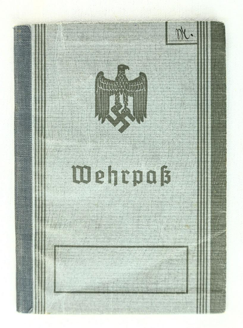 WWII German Wehrpass: Wehrpass issued to "Ruof Minofy" 18, Jan, 1939. Includes photo of the soldier. Overall good condition. See photos. Due to the high quality of German fakes, Donley Auctions has described this item to t