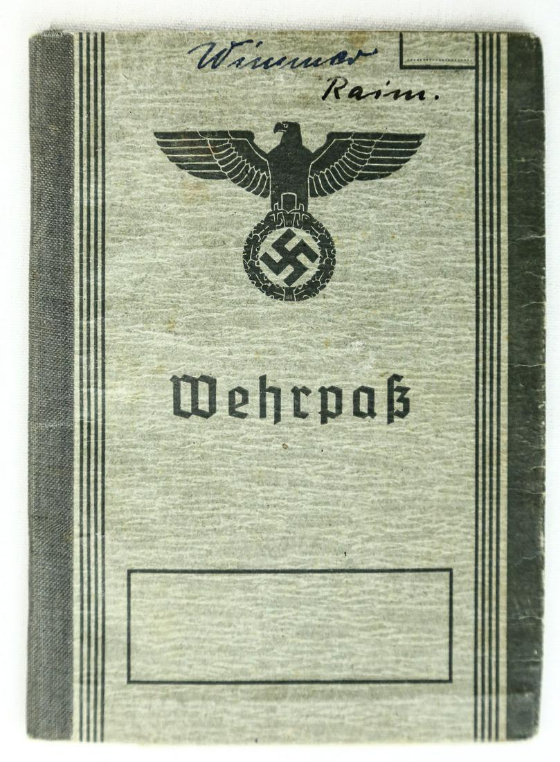 WWII German Wehrpass: Wehrpass issued to "Raimund Wimmer", 21, August, 1940. Includes photo of soldier. Overall good condition. See photos. Due to the high quality of German fakes, Donley Auctions has described this item t