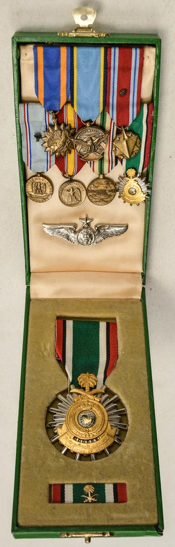 US Desert Storm Air Force Medal Grouping: Lot of US Desert Storm Air Force medal grouping. Lot contains a Saudi Arabia medal with bar and 7 small medals from the Air Force, Southwest Asian Service medal, and others. All items are in very good