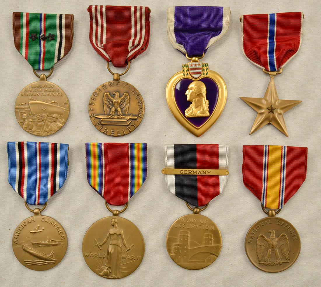 WWII US Army Medals (8): Lot consists of 8 US medals awarded during WWII. Among the medals is a named Bronze Star and Purple Heart, both named to Mike Sapalik. All medals have ribbons attached and are in good condition. See p