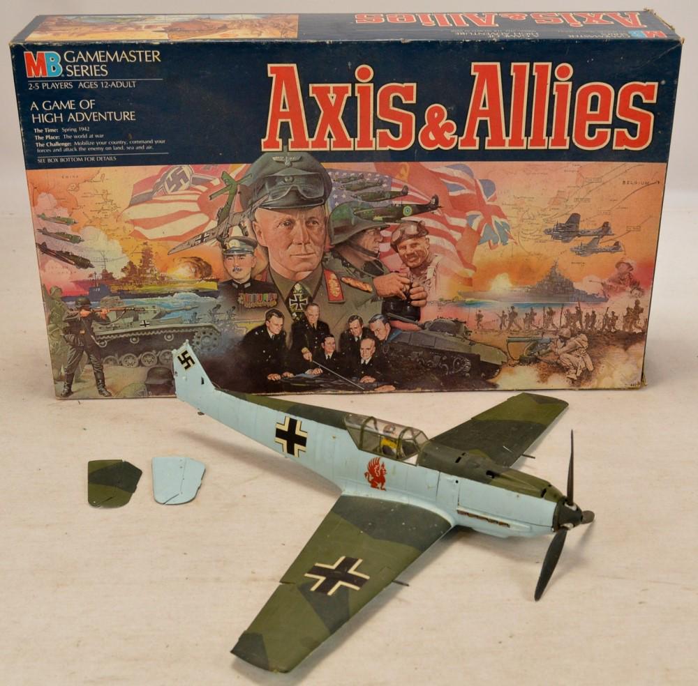 Lot of Military Toys: Lot of military toys containing a toy German BF 109 plan model and the board game Axis & Allies. Plane is in rough condition and is missing the rudder with the tail fins being separated but included. 