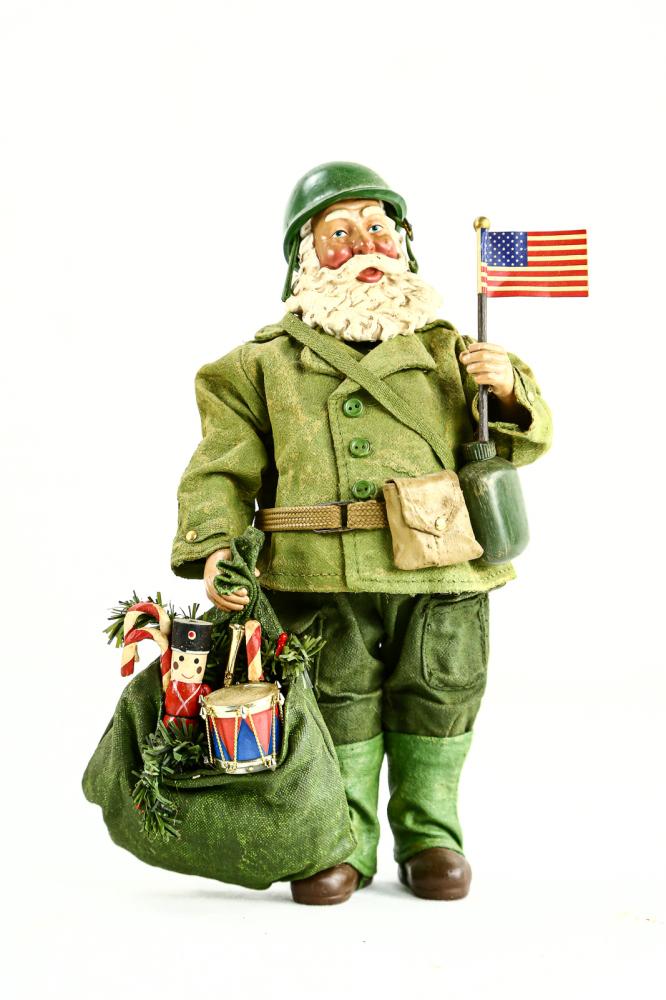 Possible Dreams WWII US Army Santa: Possible Dreams WWII US Army Santa made from stiffened fabric and plastic. Figurine stands about 10.5" and carries the American Flag in one hand and a bag of toys in the other. Overall very good condi