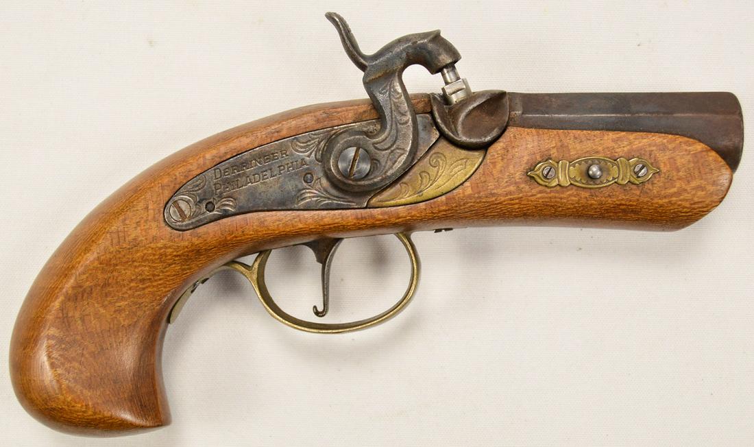Philadelphia Derringer Replica .45 Cal: Older replica in well used condition Brass trigger guard broken at rear screw. SN 095090