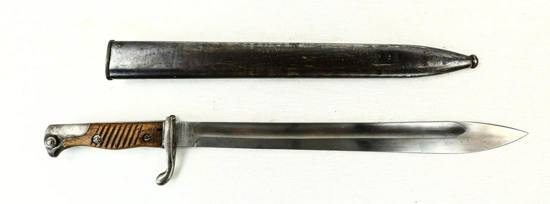WWI German "Butcher" Bayonet: Bayonet has bright blade with slightly bent tip. Blade has some chatter marks on one side near the edge and has some minor oxidation in spots. Ricasso is marked "Deutsche Maschinenfabrik, A.-G. Duisbu