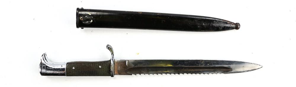 German Dress Bayonet: Blade measures 9.75", overall 15.75". Sawback blade. Some staining to blade. Lightly stamped Eikhorn back to back squirrel logo. Some small nicks to blade with some age staining. Some small blistering