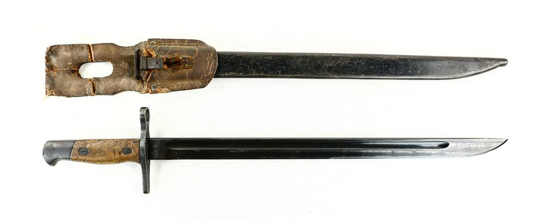 WWII Japanese Type 30 Bayonet: Bayonet has blued blade with slightly blunted tip. Blade has some bluing wear from being in and out of the scabbard and is in very good condition with the edge having some wear near the tip. Ricasso i