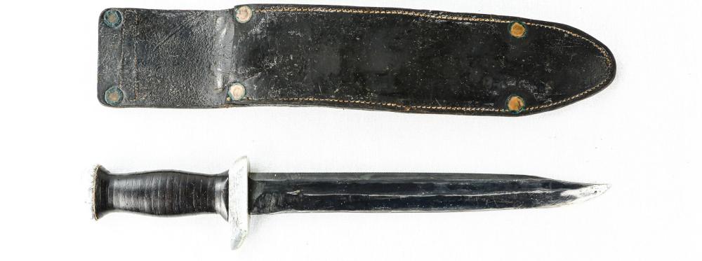 US Made Theatre Knife: US made theatre knife with a leather sheath. Knife has a small sawback blade and is sharpened. Blade and sheath are worn slightly. Overall good condition. See photos.