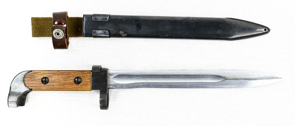AK 47 Bayonet: Grips and blade in like new condition, correct metal scabbard with canvas and leather frog in very nice condition. Blade measures 7.75".