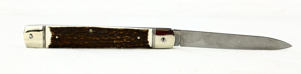 Hubertus Side Opening Switchblade: Hubertus side opening switchblade. Made in Germany. Measures 10 inches long when open. Lever activated. This is the largest switchblade Hubertus makes. Genuine stag handles. Nickle silver bolsters. Ne