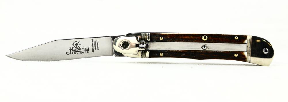 Hubertus Side Opening Switchblade: Hubertus side opening switchblade. Made in Germany. Measures 7 inches open. Genuine stag handles. New. See photos.