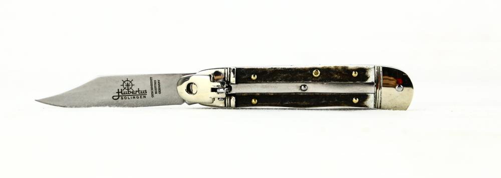 Hubertus Side Opening Switchblade: Hubertus side opening switchblade. Made in Germany. Lever action. Measures 5 7/8 inches when open. Small called lilliput. Genuine stage handles. New. See photos.