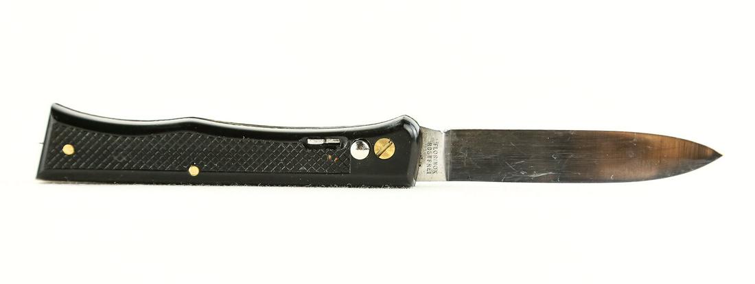 French Florinox Side Opening Switchblade: French Florinox switchblade. 6.5 inches long. Made in France. Tang stamp Florinox Rostfrei. Hard black plastic checkered handles with safety. RARE. See photos.