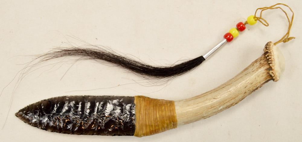 Obsidian and Antler Knife: Obsidian and antler knife. Obsidian blade is tied to an antler piece with a small string lanyard with beads and hair. Blade is tied tightly to the antler and does not wobble. Blade is sharp. Antler ha