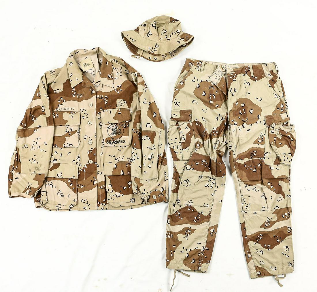 Gulf War US Navy Seabees Uniform: Lot contains a jacket, a pair of pants, and a boonie hat, all in the desert "chocolate chip" camp pattern. Jacket is marked "US Navy" and "Seabees" in black ink with the Seabees emblem on the left bre