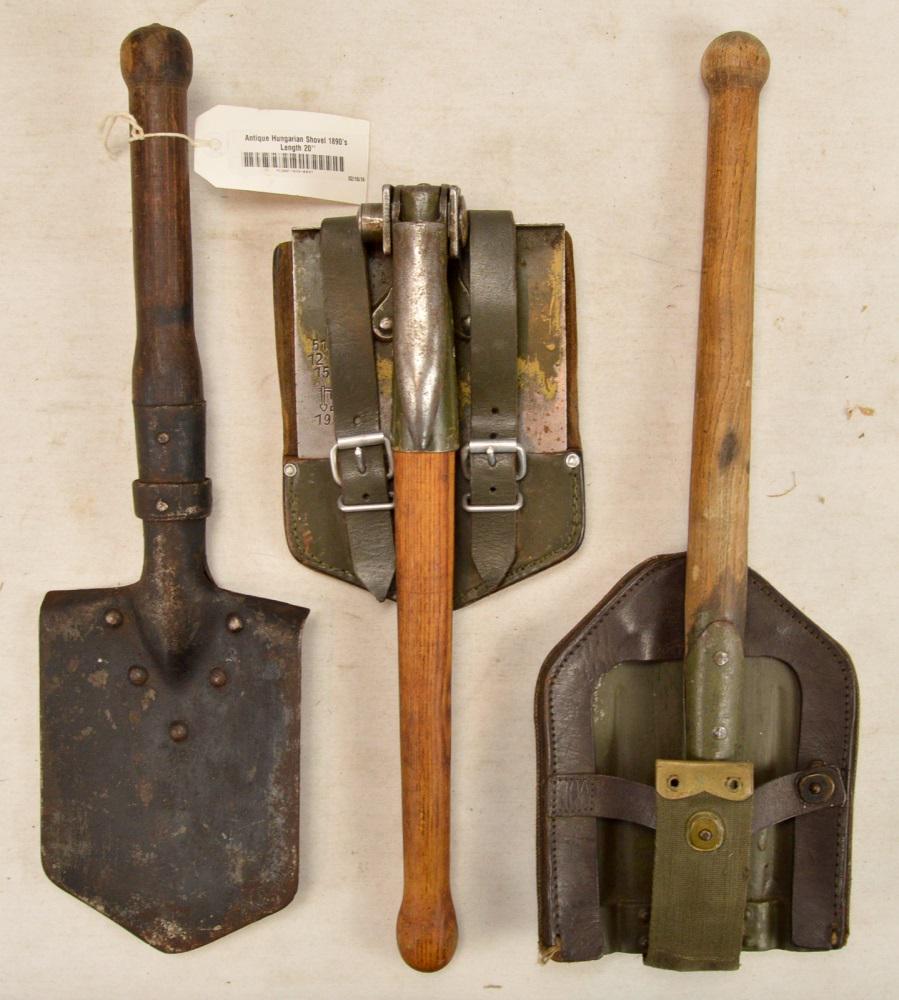 Military Entrenching Shovels: Includes: Hungarian 1890 military shovel. WWII era, unknown country, folding entrenching tool w leather & web covering, snaps tight, in good condition. 1964 German folding entrenching tool with pick a