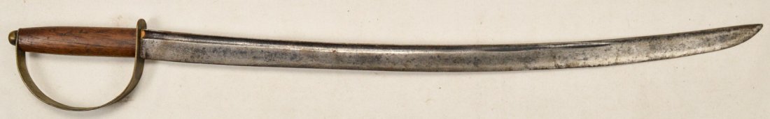 Short Saber: A sword in the style of a cavalry saber with an old blade and newer crossguard. Blade has pointy tip and sharp edge with some minor nicks in edge. Blade has some pitting and oxidation present througho